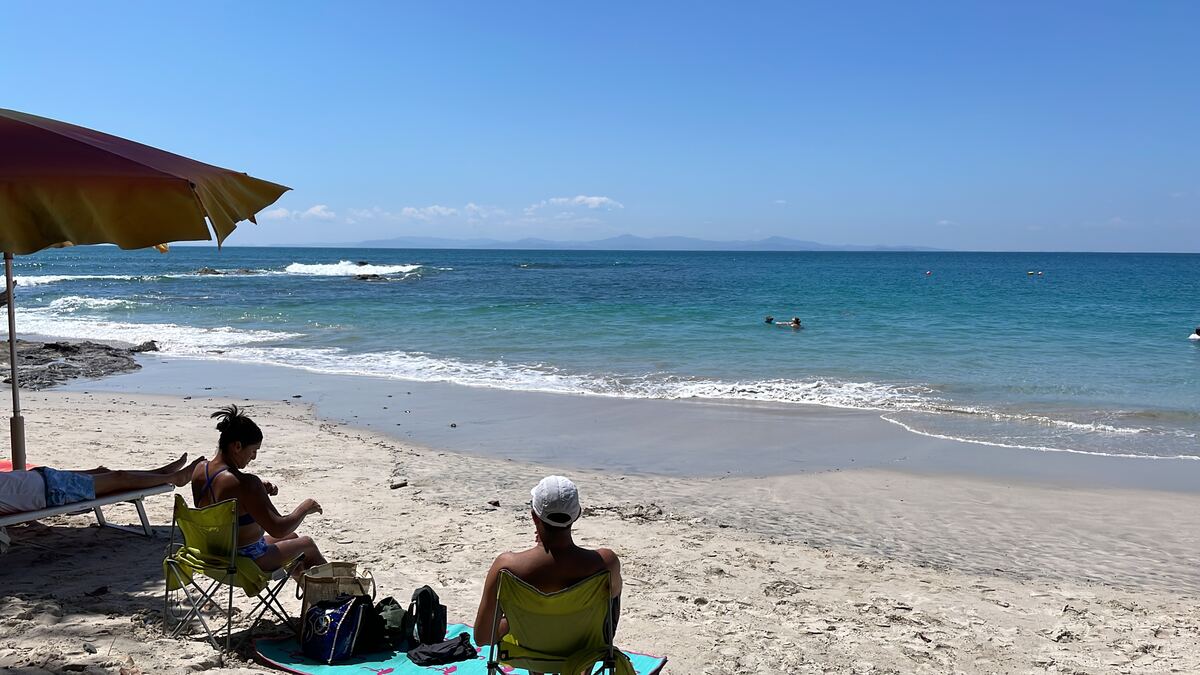 White sand beach near Jacó Costa Rica with beach umbrella