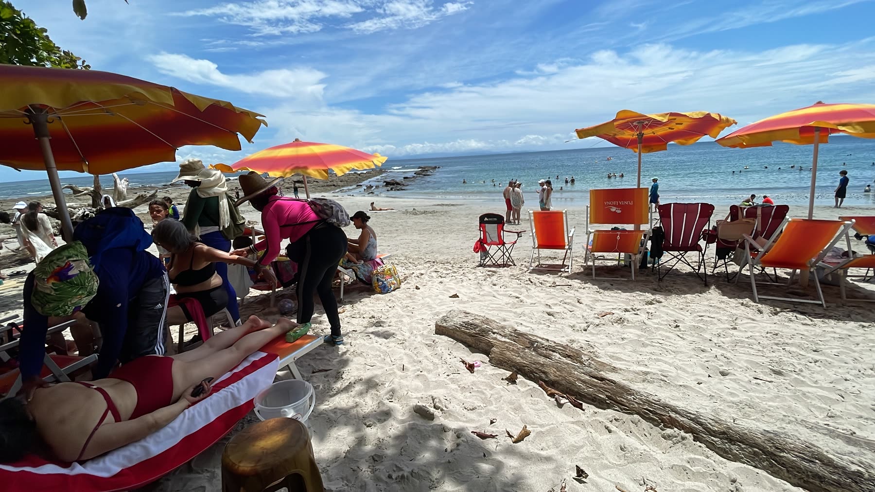 Beach umbrellas and chairs at Playa Mantas — top snorkel tour Jaco beach