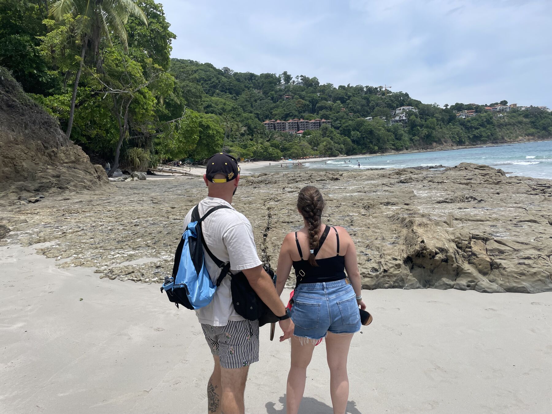 Snorkeling a calm, clear white-sand cove near Playa Mantas — one of the best things to do in Jaco Beach, Costa Rica