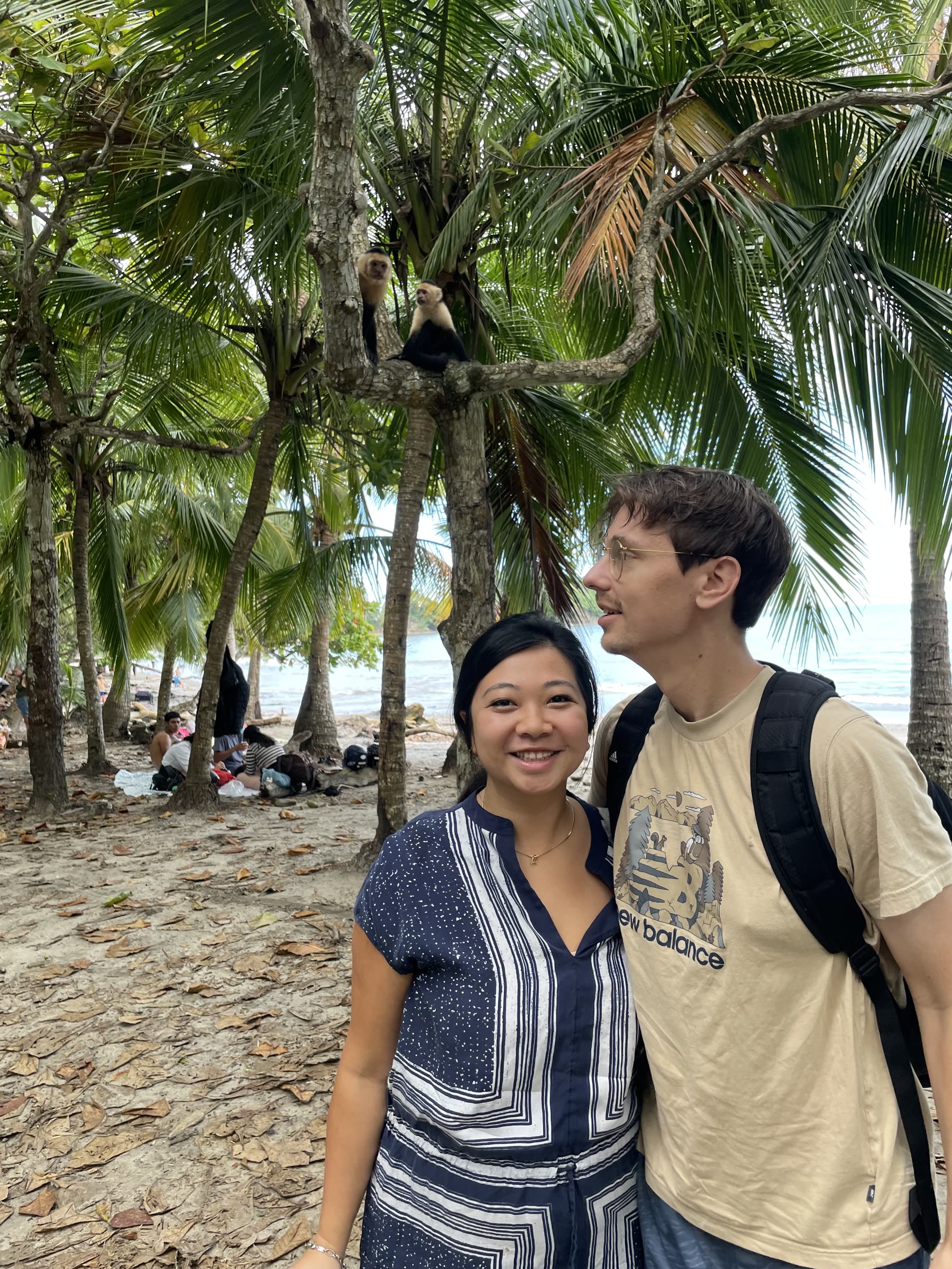 Guests under the palms at Playa Mantas — Jaco Costa Rica best snorkeling