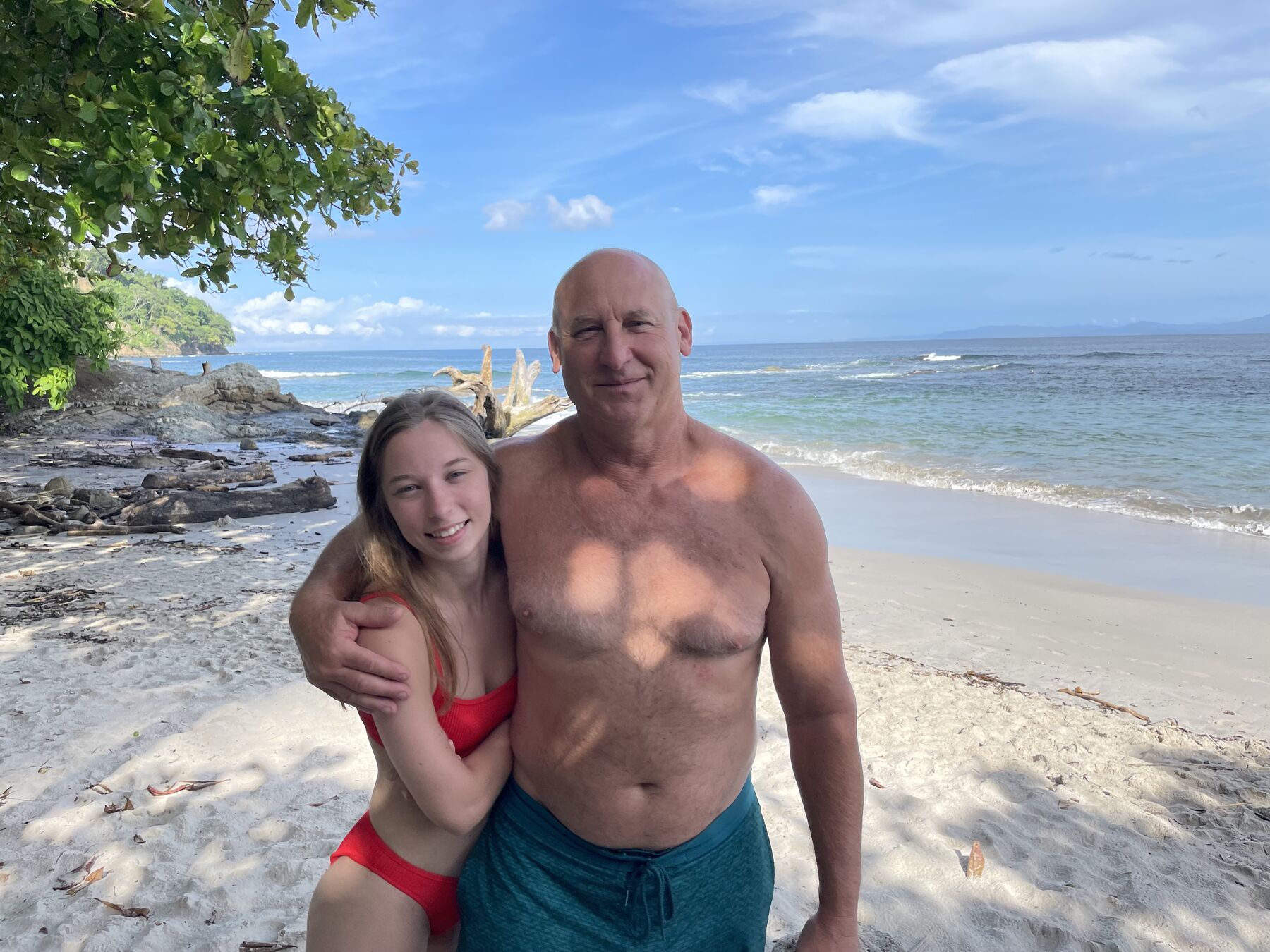 A couple posing with the reef behind them at Playa Mantas — Jaco Costa Rica best snorkeling