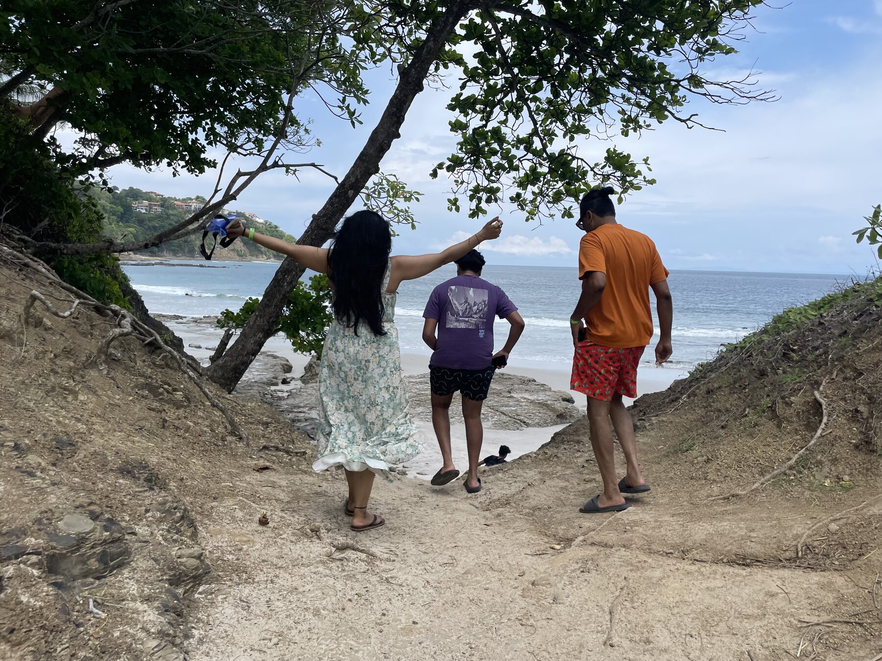 Guests heading down the shaded path to the cove at Playa Mantas — top snorkel tour Jaco beach