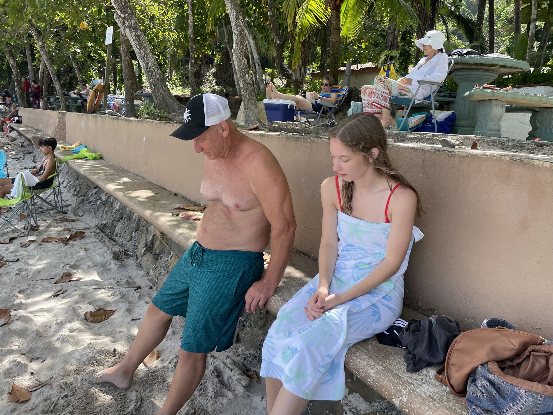 Guests relaxing in the shade at Playa Mantas on a best snorkel tour Jaco beach day