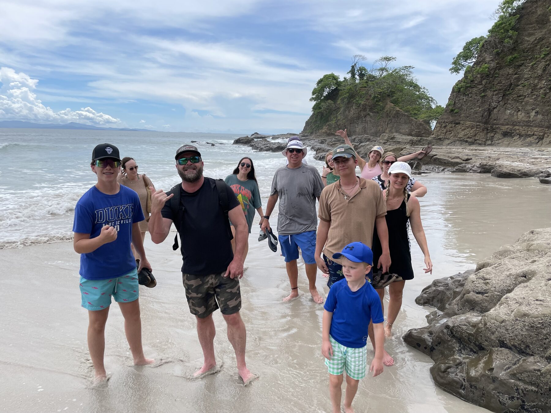 A family walking the beach at Playa Mantas — top snorkel tour Jaco beach