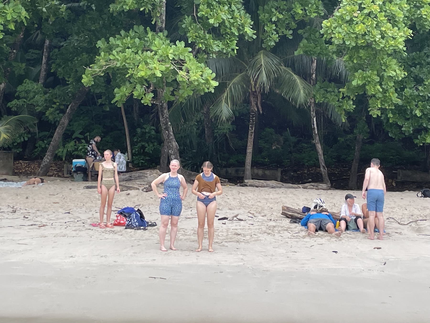 Guests on the palm-backed beach at Playa Mantas — Jaco Costa Rica best snorkeling