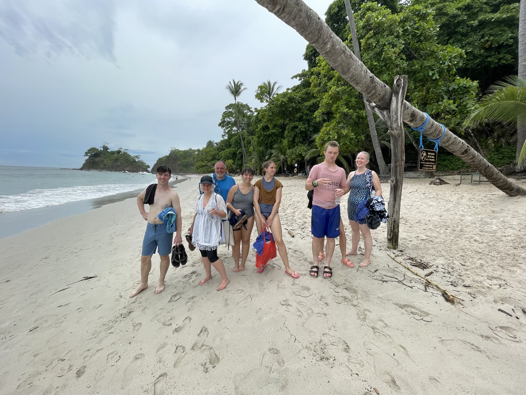 A group of guests on the palm-backed beach at Playa Mantas — Jaco Costa Rica best snorkeling