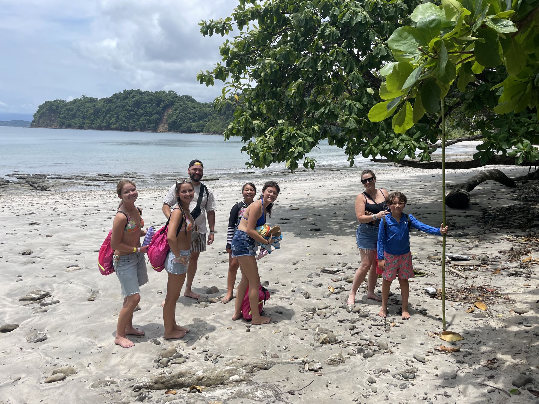 A group of guests posing on the beach at Playa Mantas — Jaco Costa Rica best snorkeling