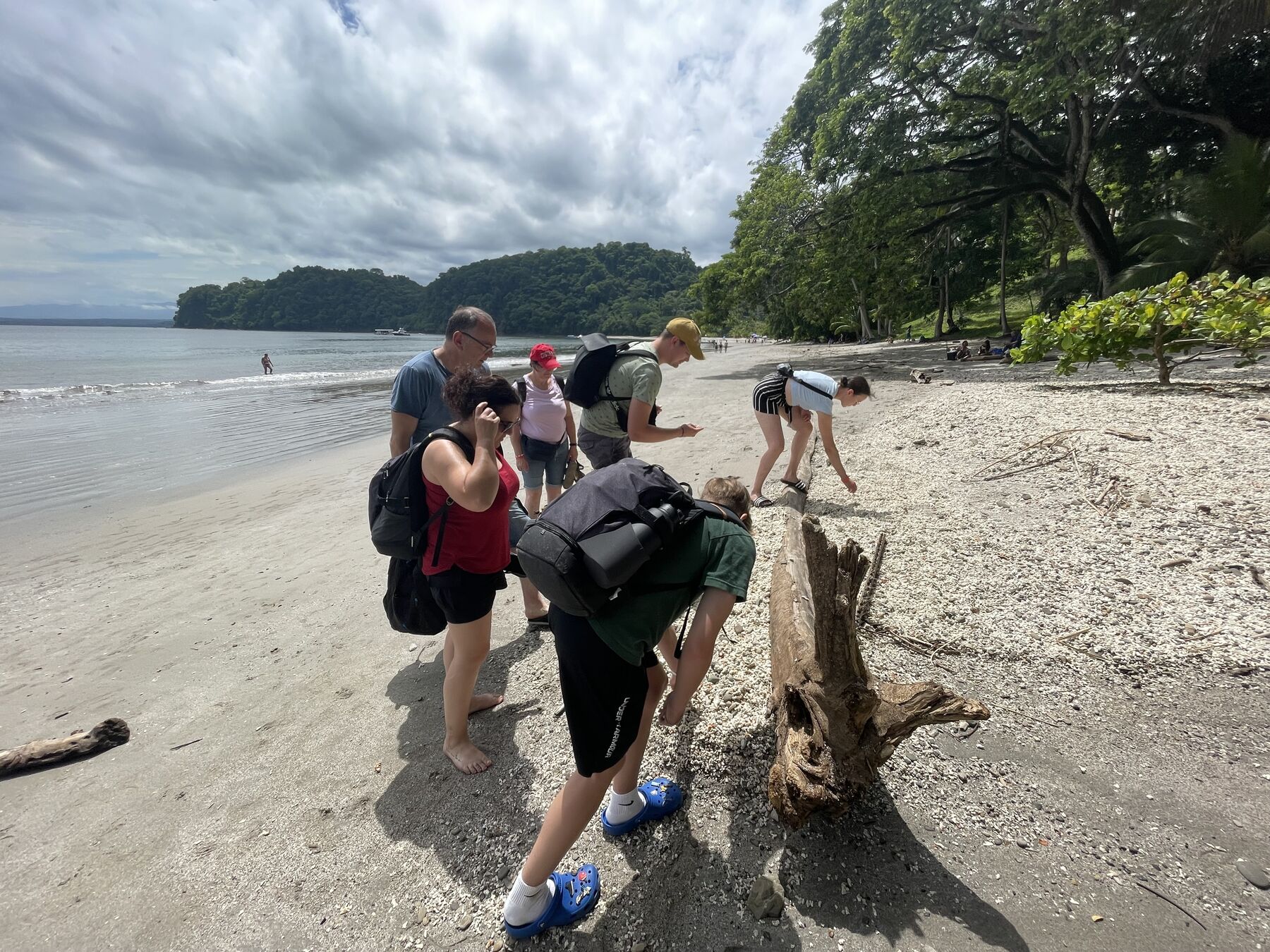 Guests out by the rocky point at Playa Mantas — top snorkel tour Jaco beach