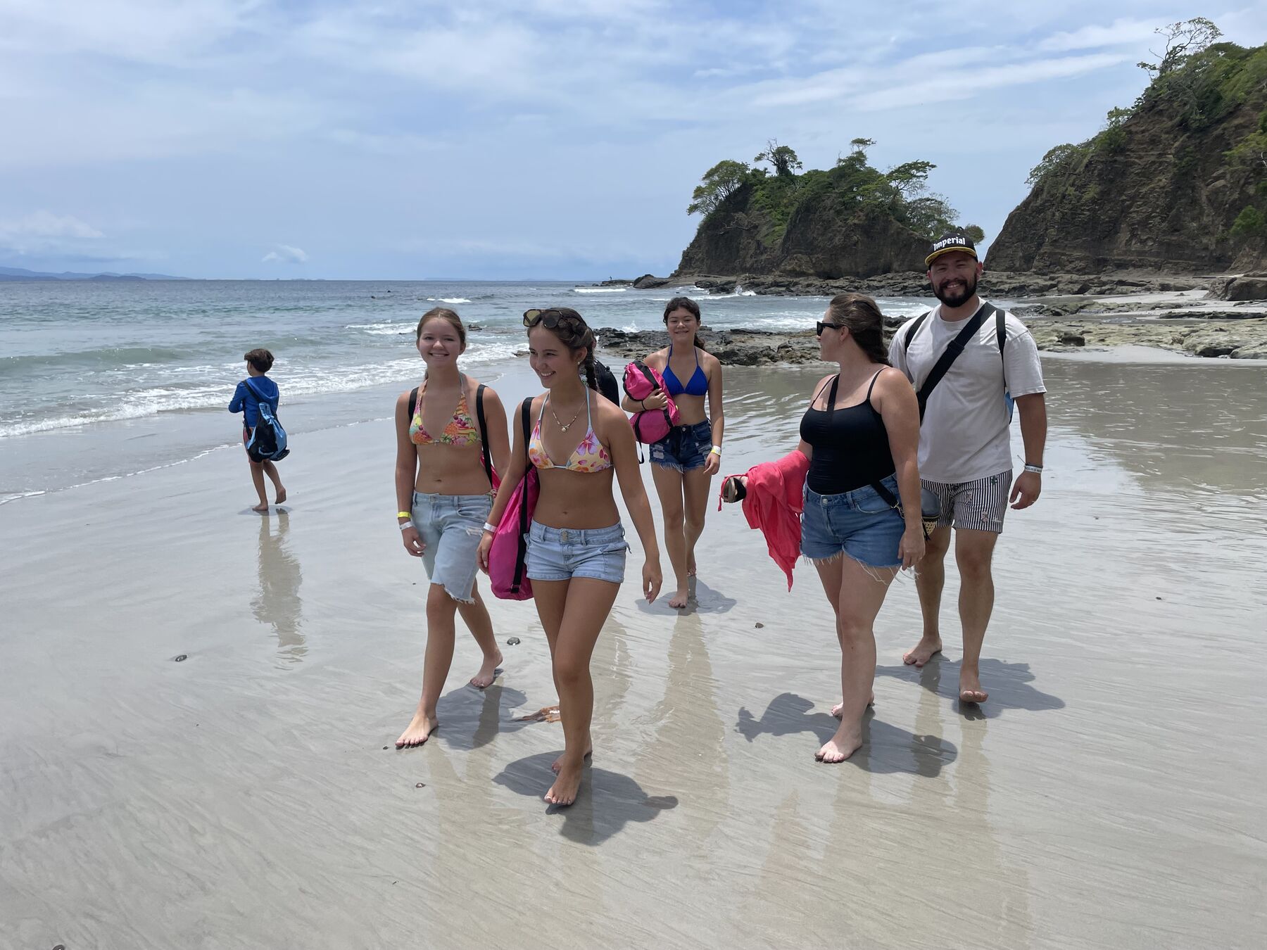 Snorkel Jaco tour group walking the white sand beach near Jacó Costa Rica