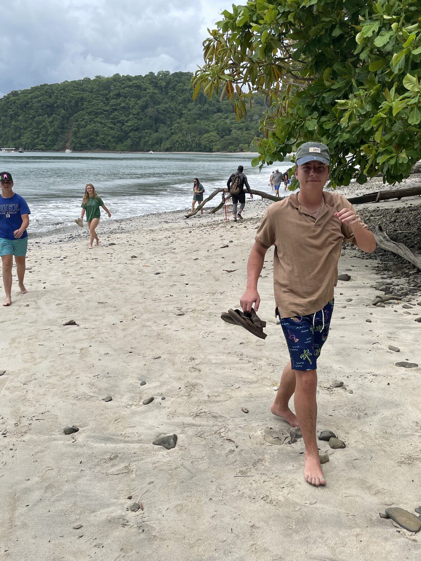 A guest walking the beach at Playa Mantas on a best snorkel tour Jaco beach day