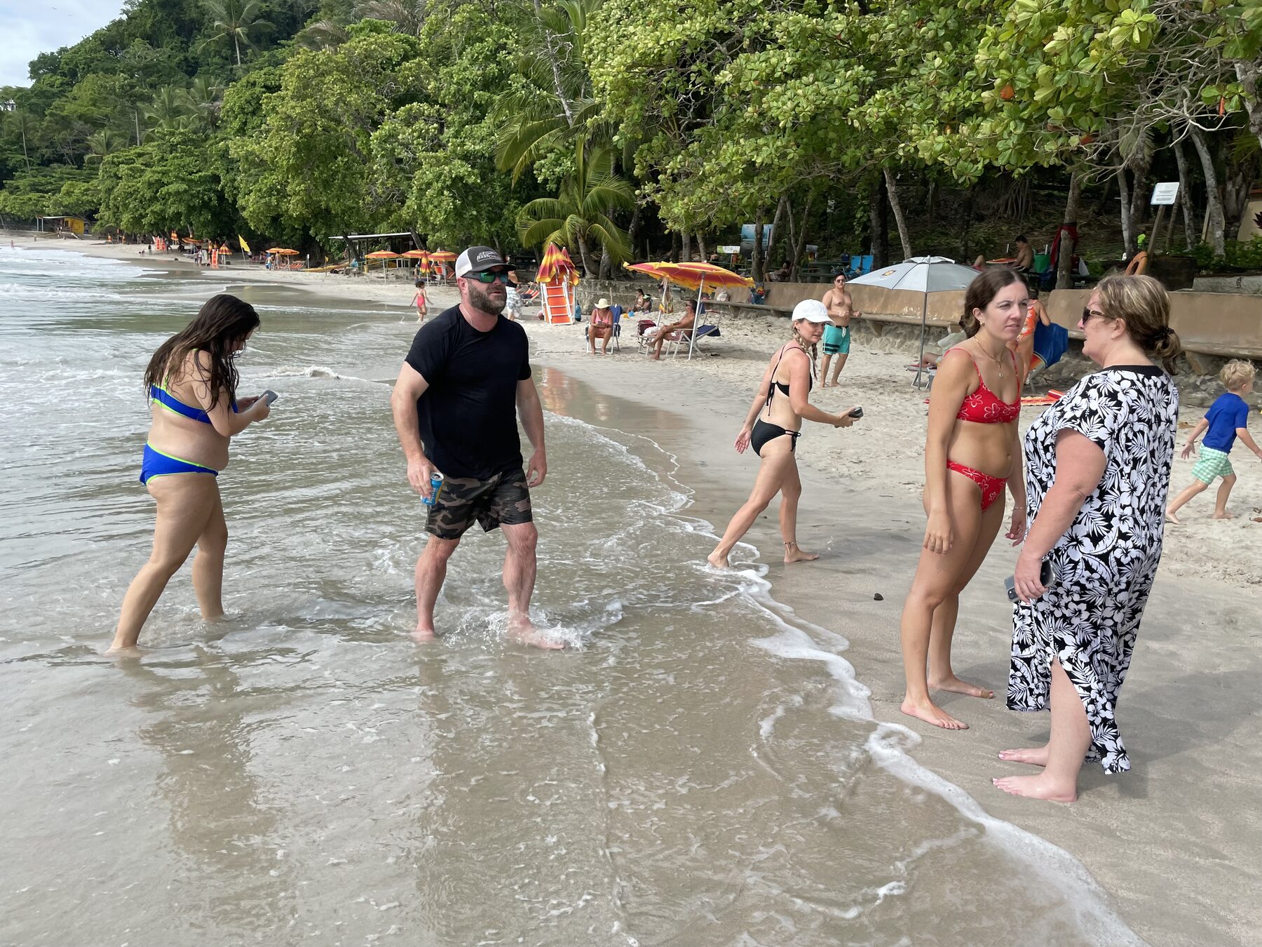 Guests in the shallow clear water at Playa Mantas — Jaco Costa Rica best snorkeling