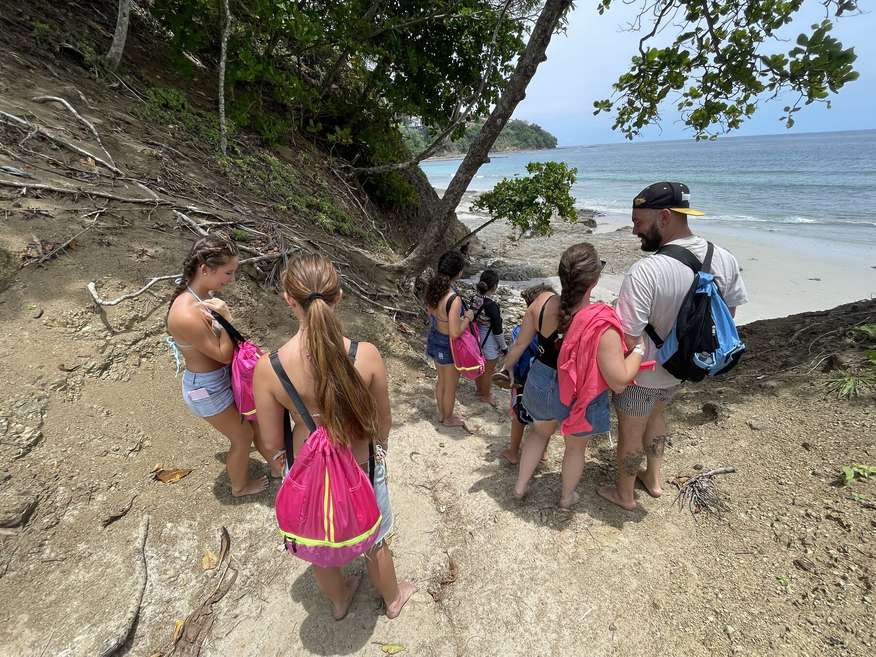 A Snorkel Jaco guide leading guests down to the water at Playa Mantas — Jaco Costa Rica best snorkeling
