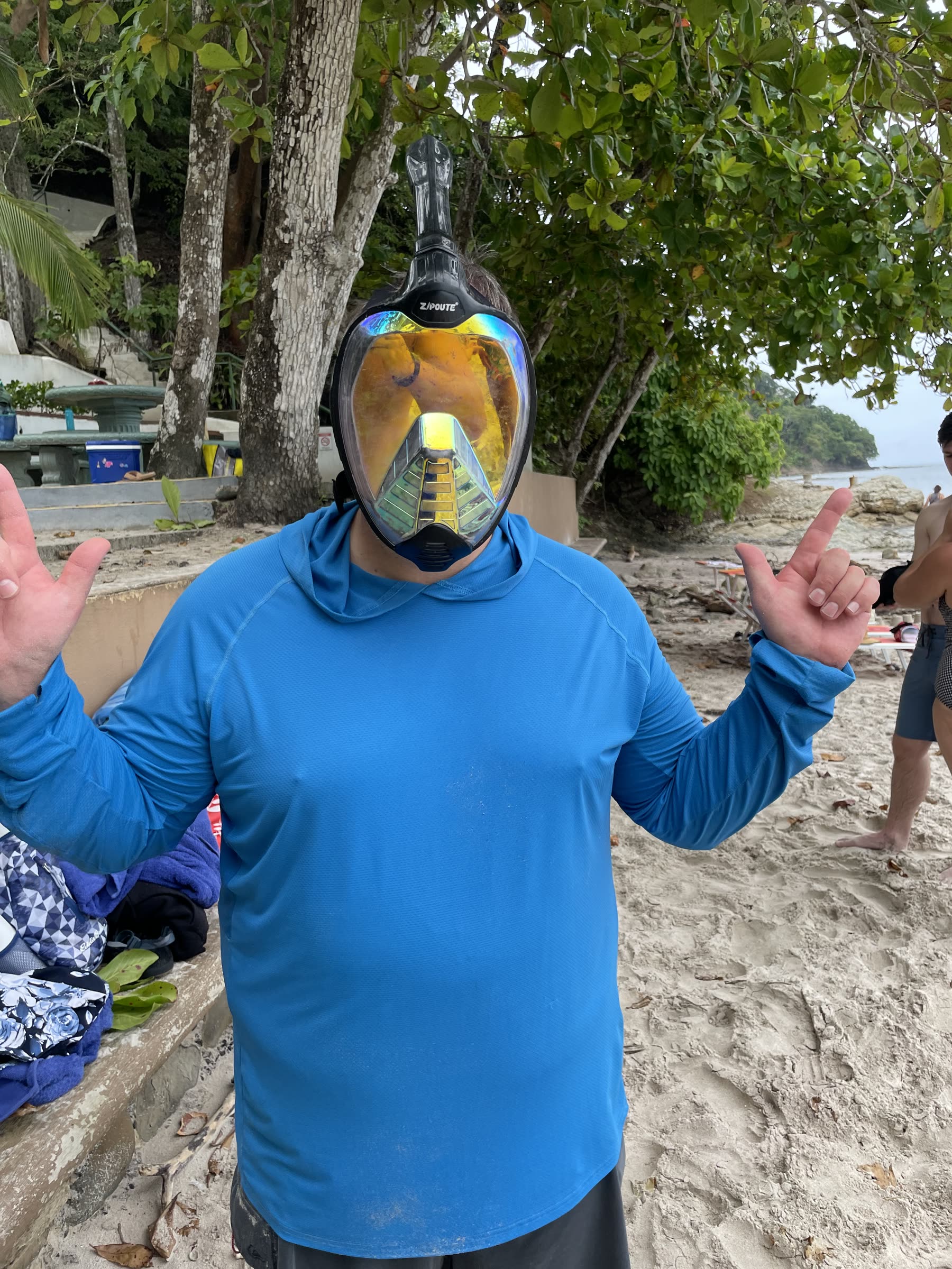 A happy guest in a full-face snorkel mask throwing a peace sign at Playa Mantas — Jaco Costa Rica best snorkeling