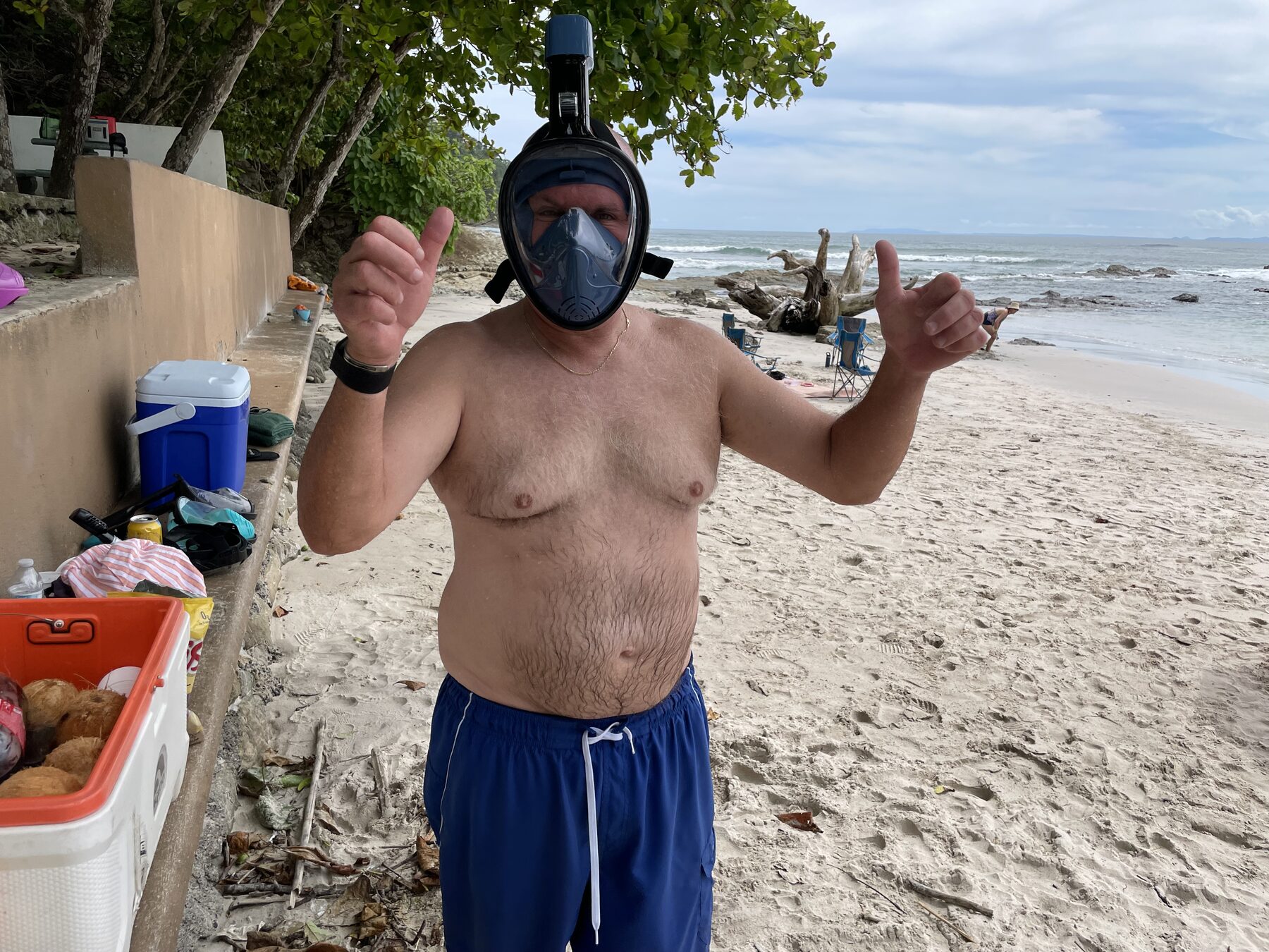 A guest in a full-face snorkel mask on the beach at Playa Mantas — Jaco Costa Rica best snorkeling