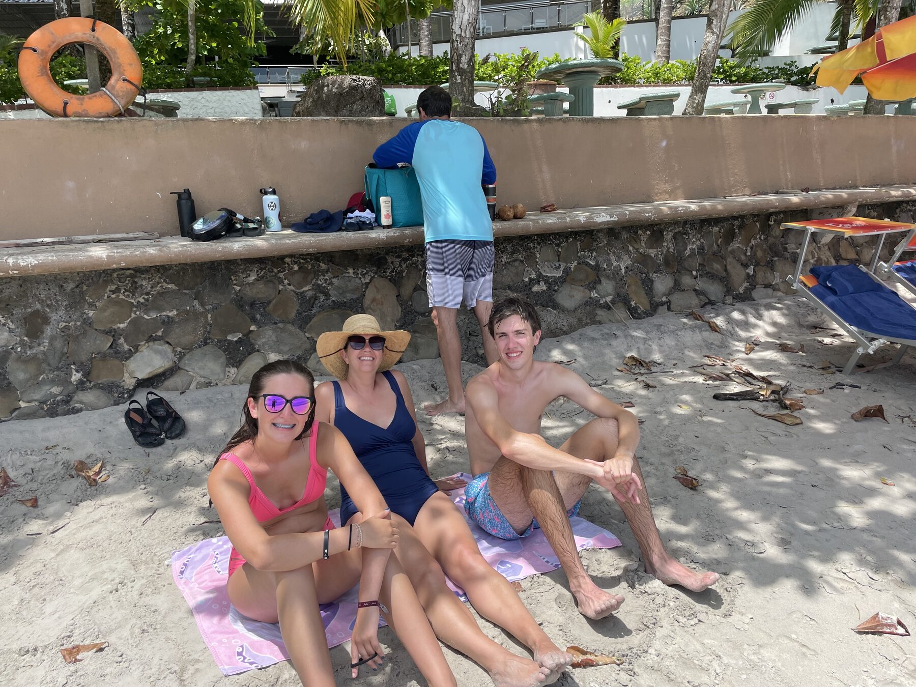 Happy guests smiling on the beach after a Jaco beach snorkeling tour at Playa Mantas