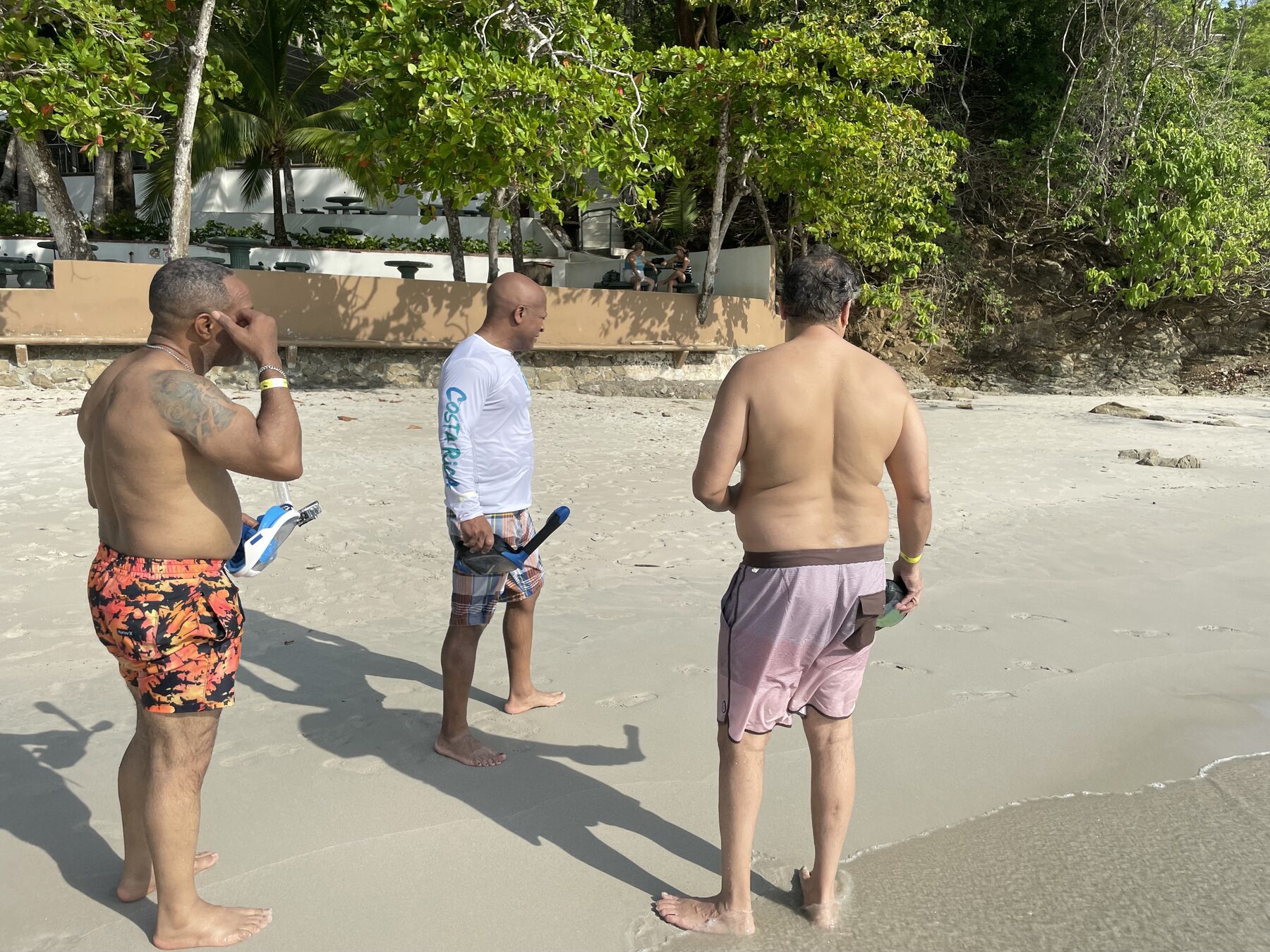 Gearing up with masks and fins before heading into the water. — Jacó beach snorkel tours with Snorkel Jaco