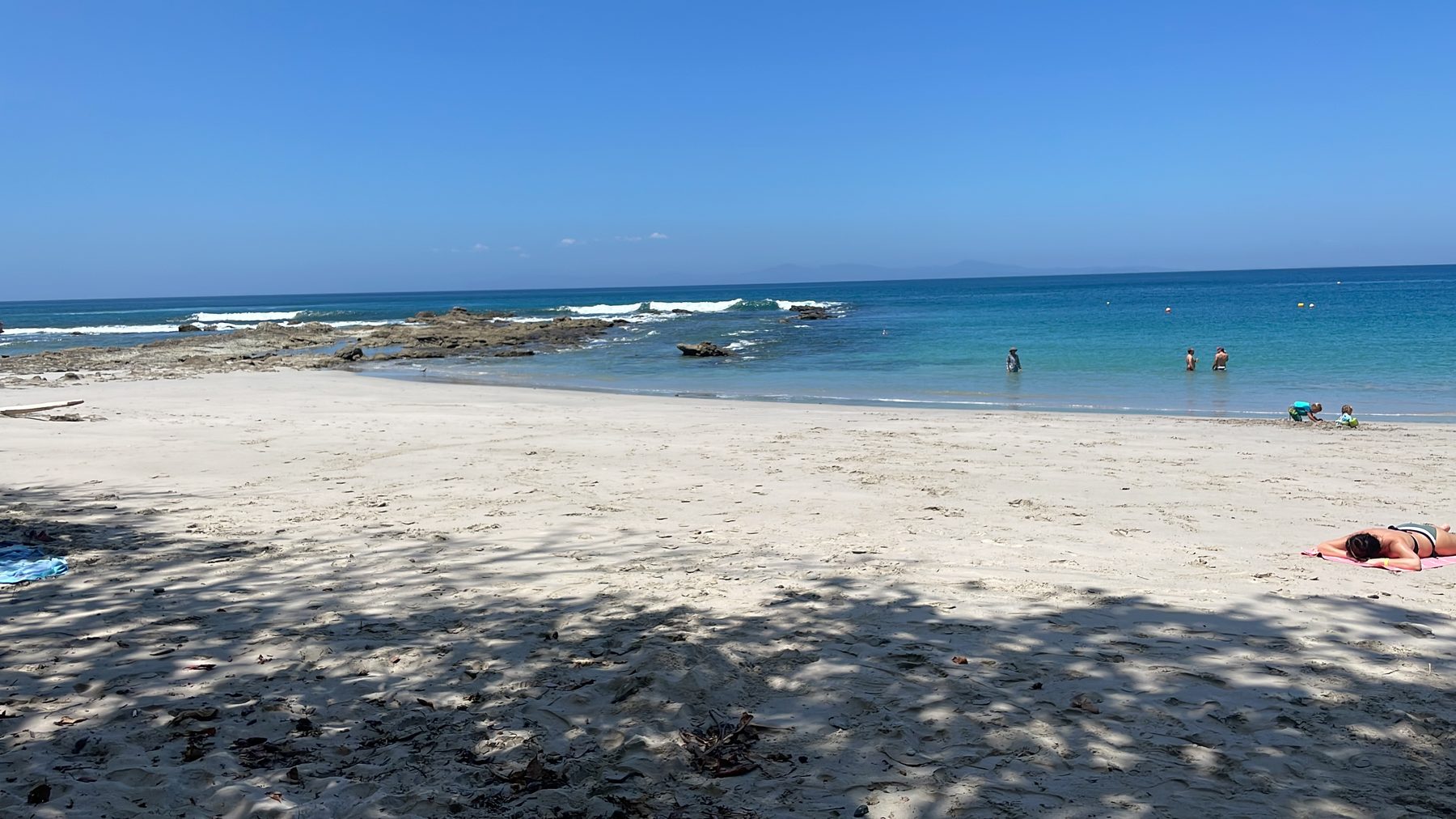 Clear calm water at Playa Mantas snorkeling cove near Jacó Beach Costa Rica