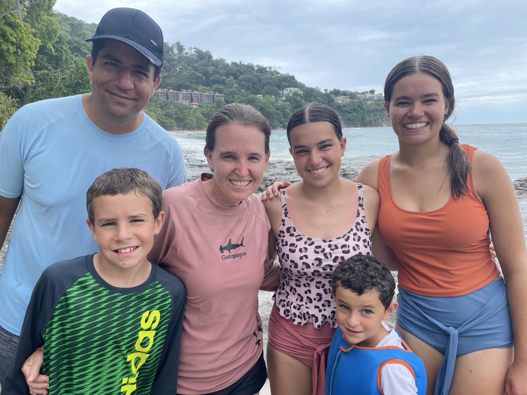 A happy family on the beach at Playa Mantas — Jaco Costa Rica best snorkeling