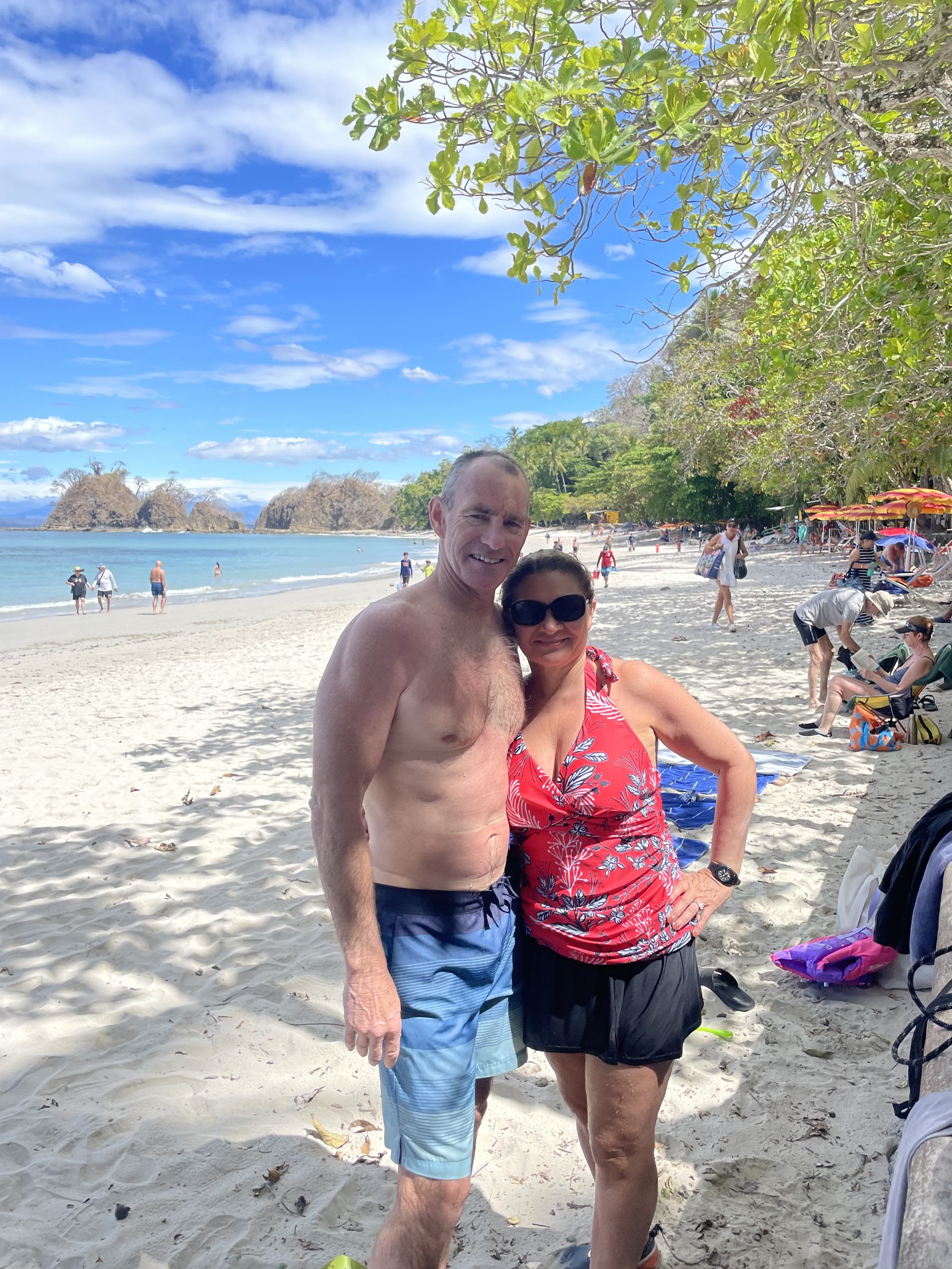 A couple on the beach at Playa Mantas on a best snorkel tour Jaco beach day