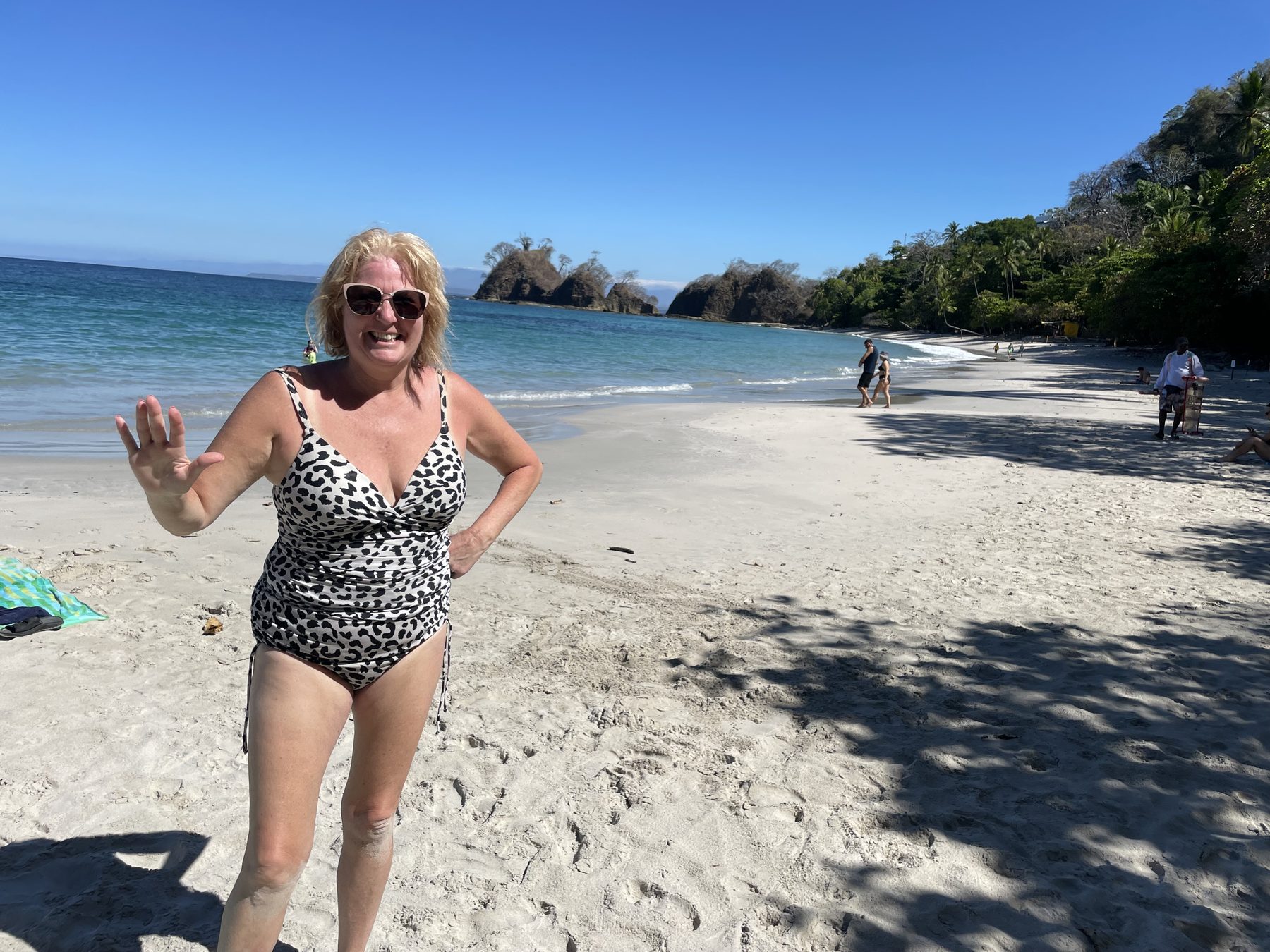 Guest on the beach after booking Jacó Beach snorkel tours online with a credit card