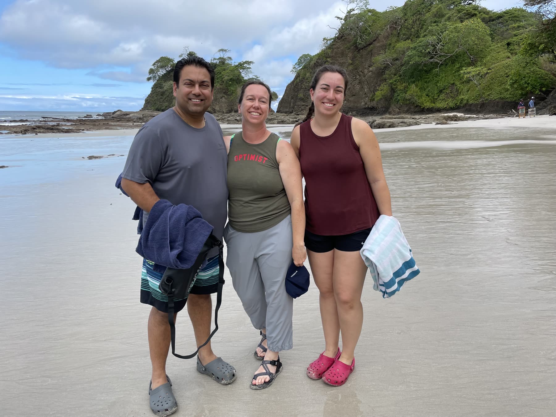 Three guests posing on the beach at Playa Mantas — top snorkel tour Jaco beach