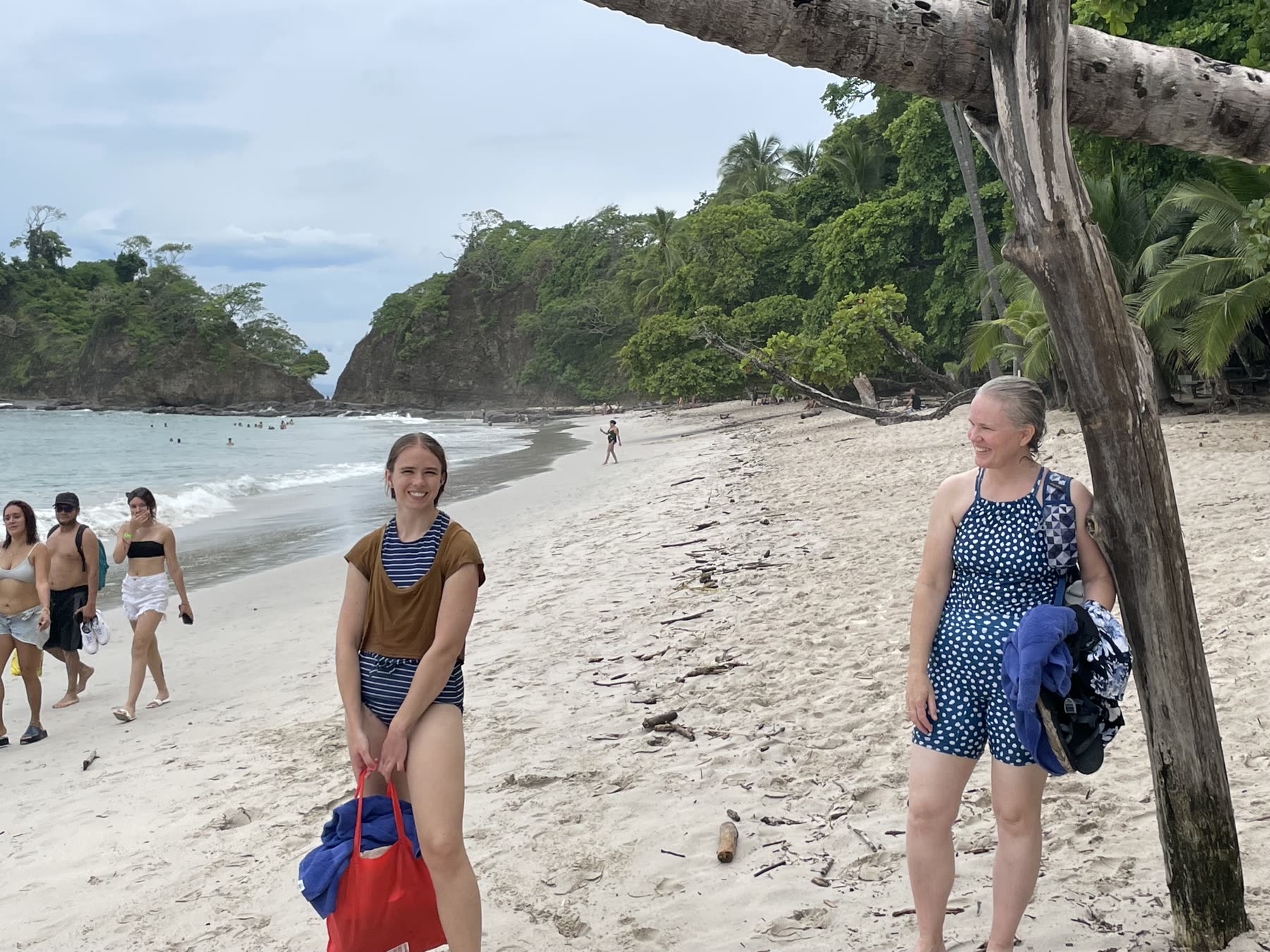 Two guests walking the beach at Playa Mantas — Jaco Costa Rica best snorkeling