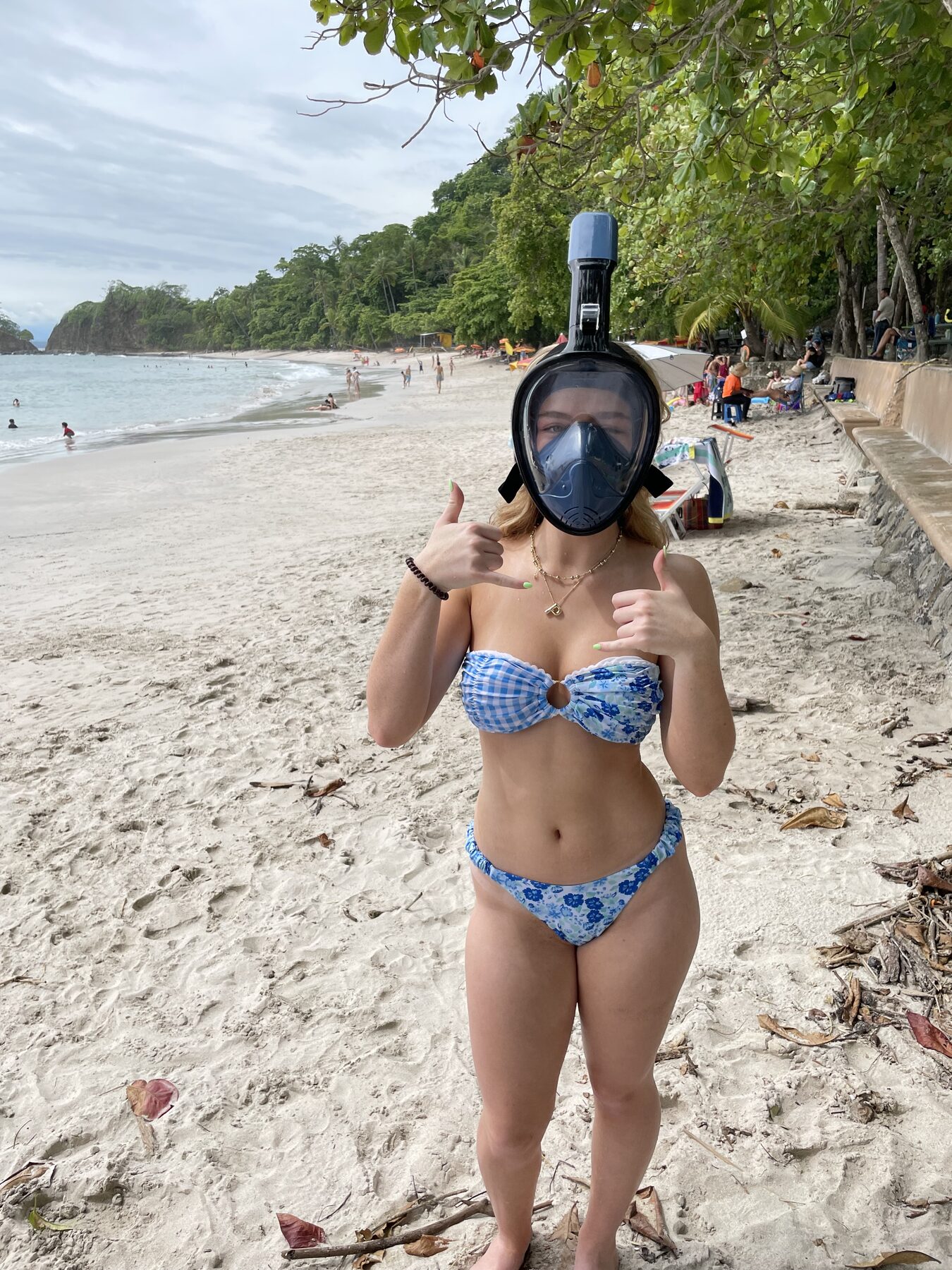 A guest giving a thumbs-up in her full-face snorkel mask at Playa Mantas on a best snorkel tour Jaco beach day