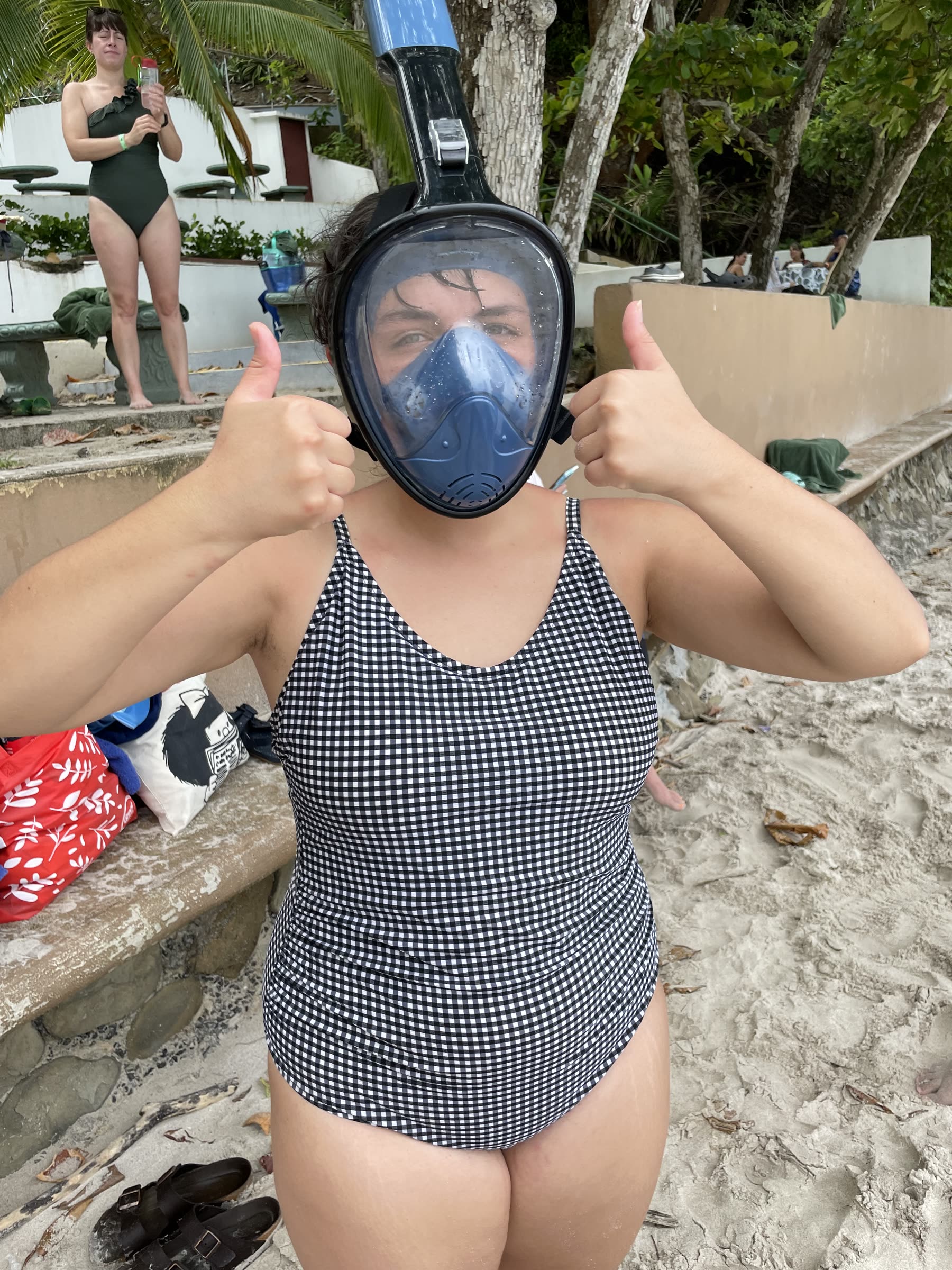 A guest in a full-face snorkel mask giving a thumbs up at Playa Mantas on a best snorkel tour Jaco beach day